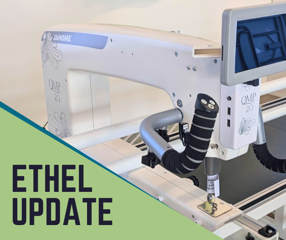 A long-arm quilting machine with a the text 