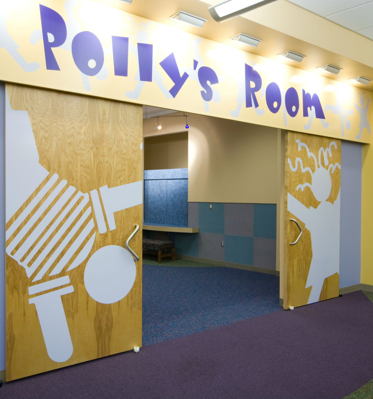 Wooden sliding doors open to show a small room